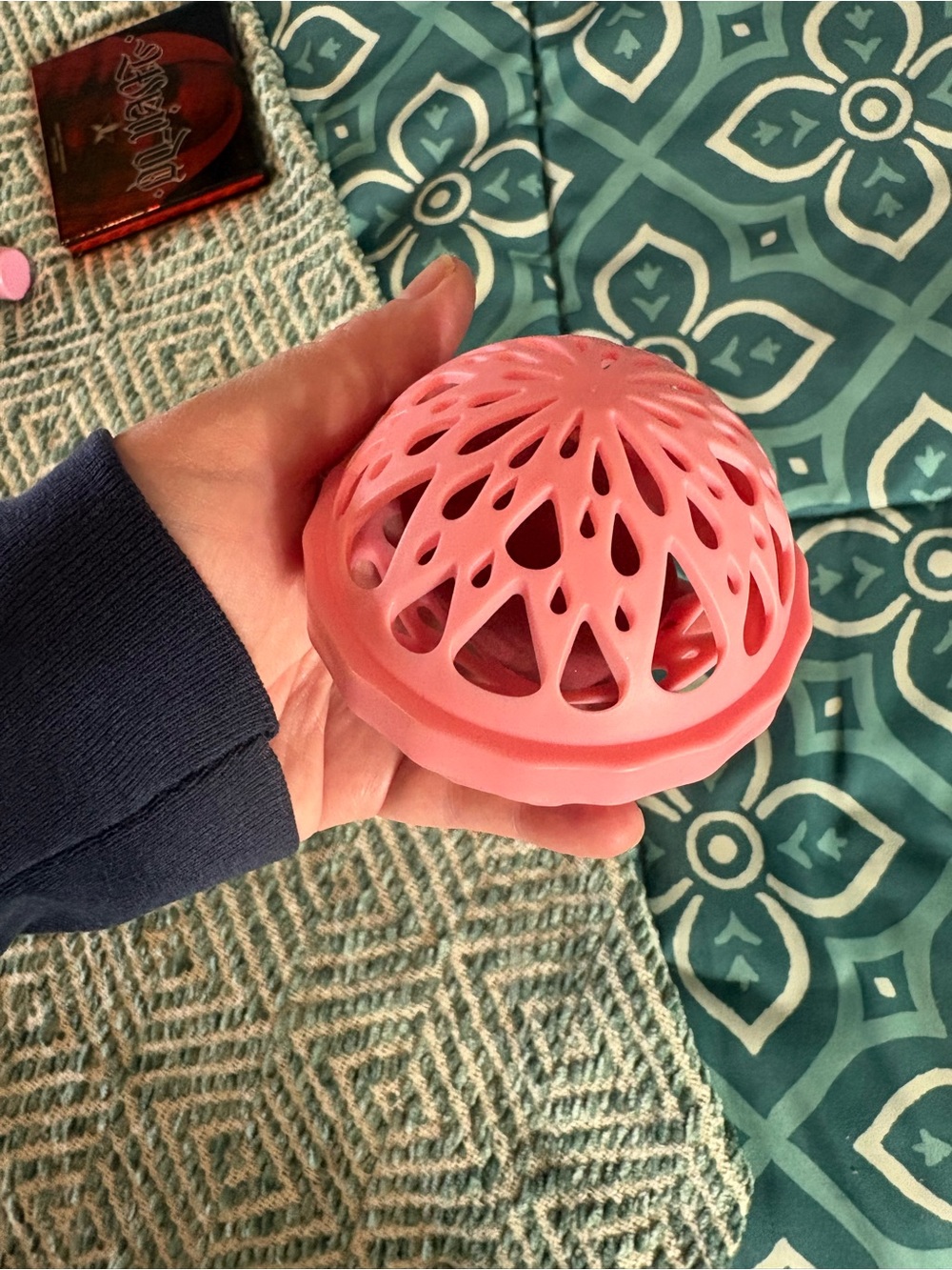Red foundation sponge with pink washing machine protector